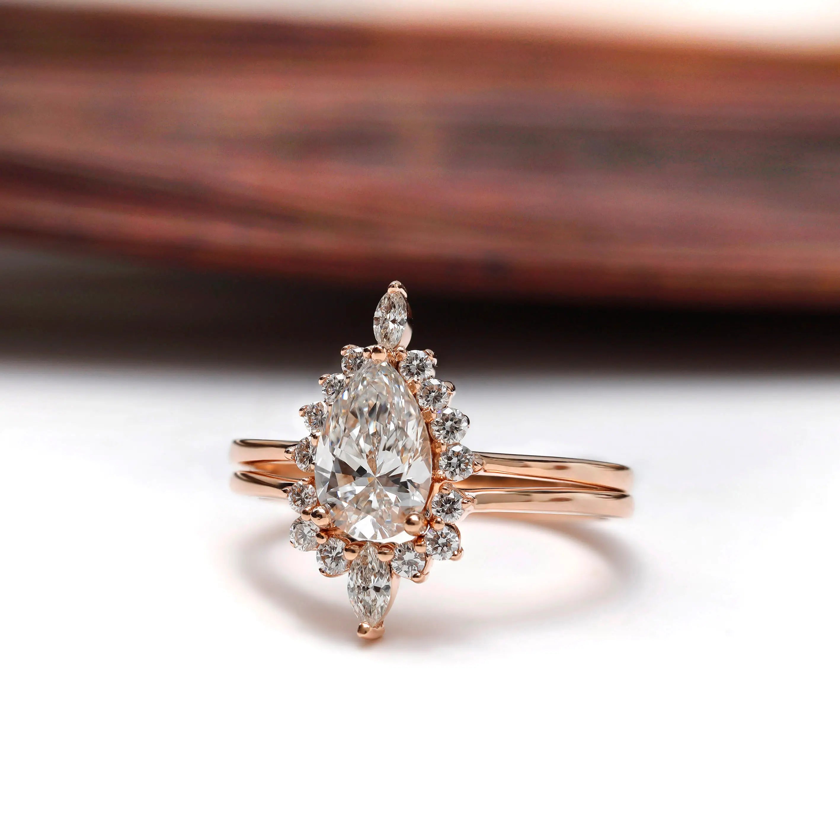 Rose gold pear diamond cluster ring with matching band