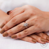 Pear lab grown diamond cluster ring set worn on hand