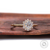 Yellow gold halo engagement ring with round center diamond