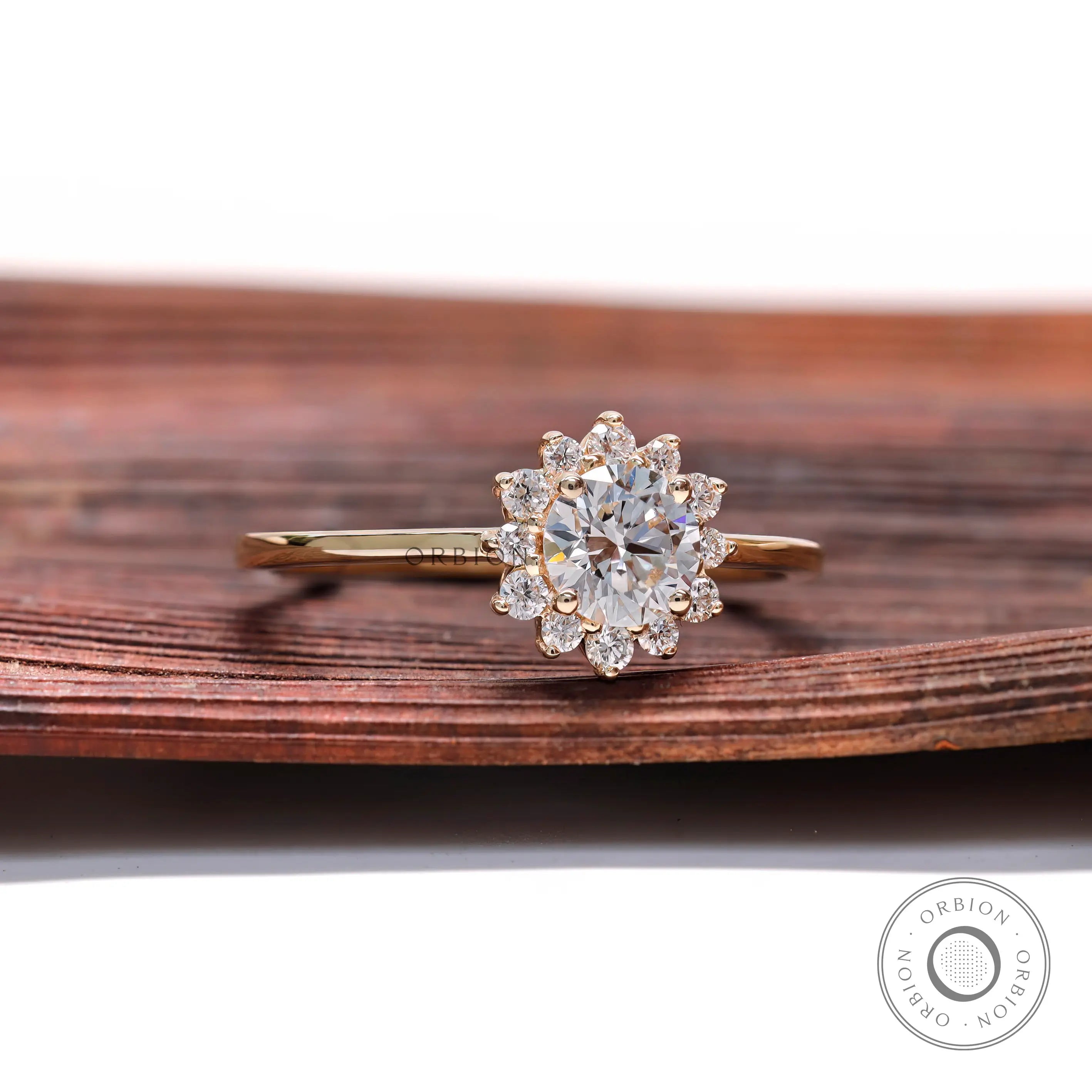 Yellow gold halo engagement ring with round center diamond