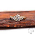 Oval lab grown diamond cluster engagement ring in 14K yellow gold