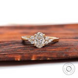 Oval lab grown diamond cluster engagement ring in 14K yellow gold