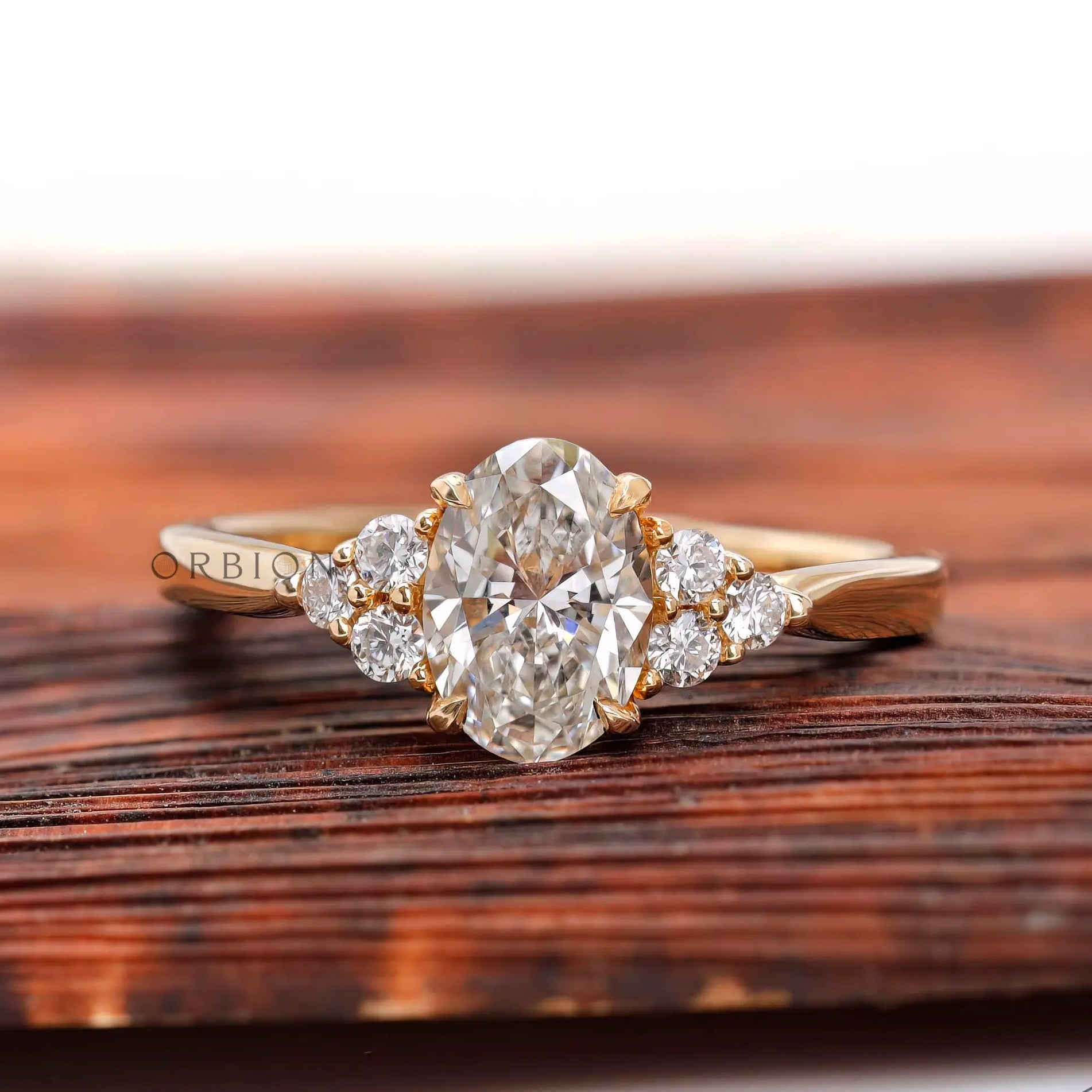Oval lab grown diamond cluster engagement ring in 14K yellow gold