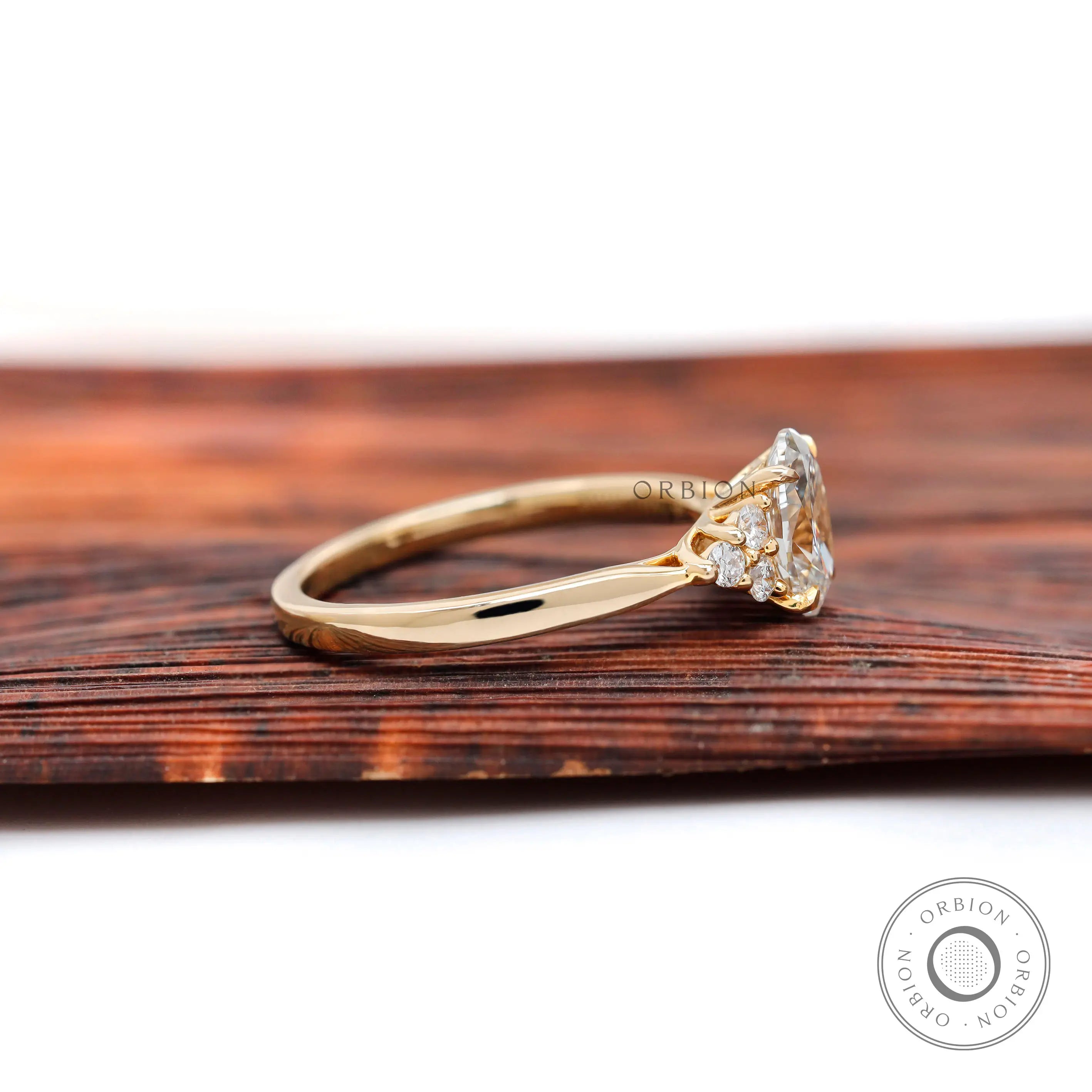 Yellow gold oval diamond cluster ring