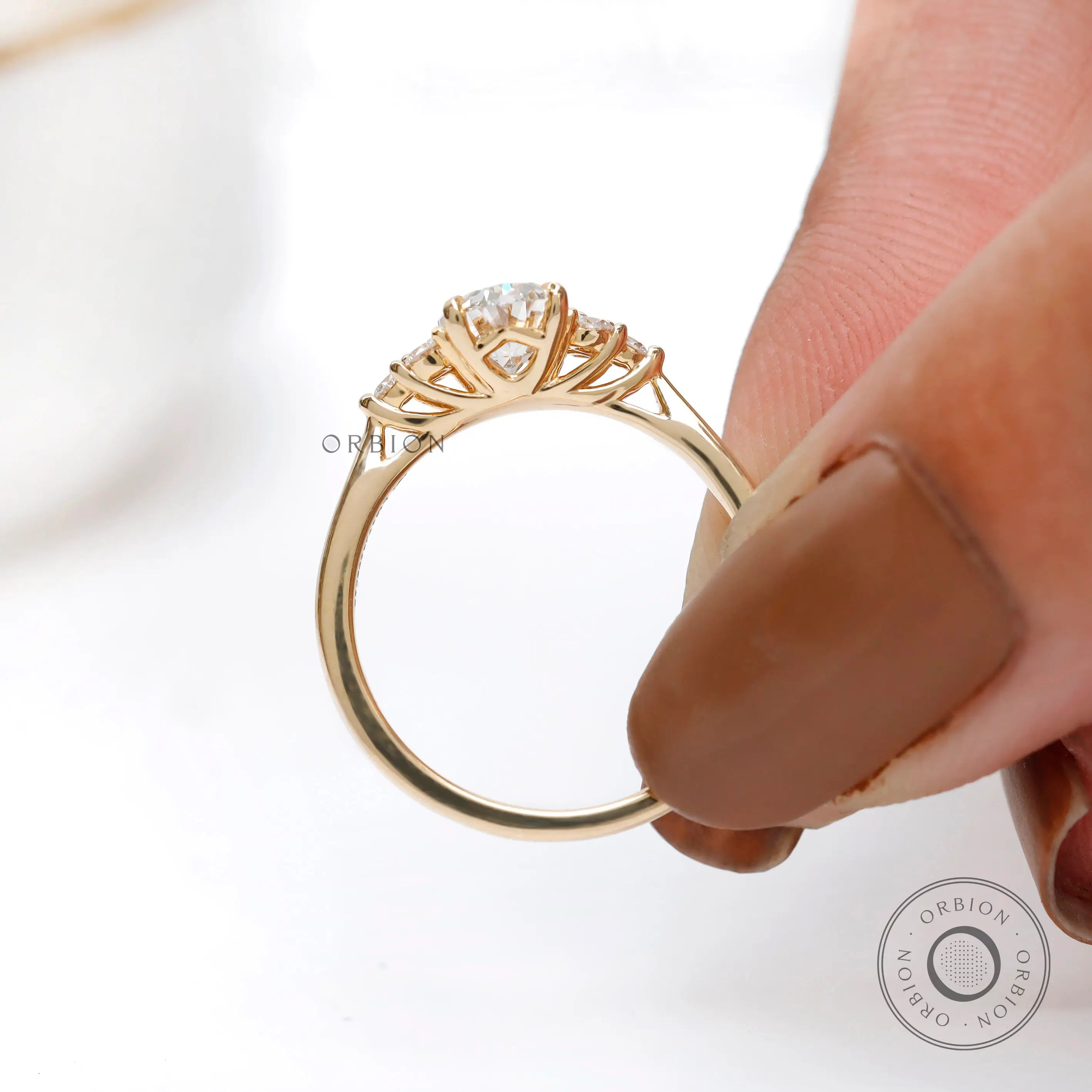 Elegant oval cluster ring with tapered yellow gold band