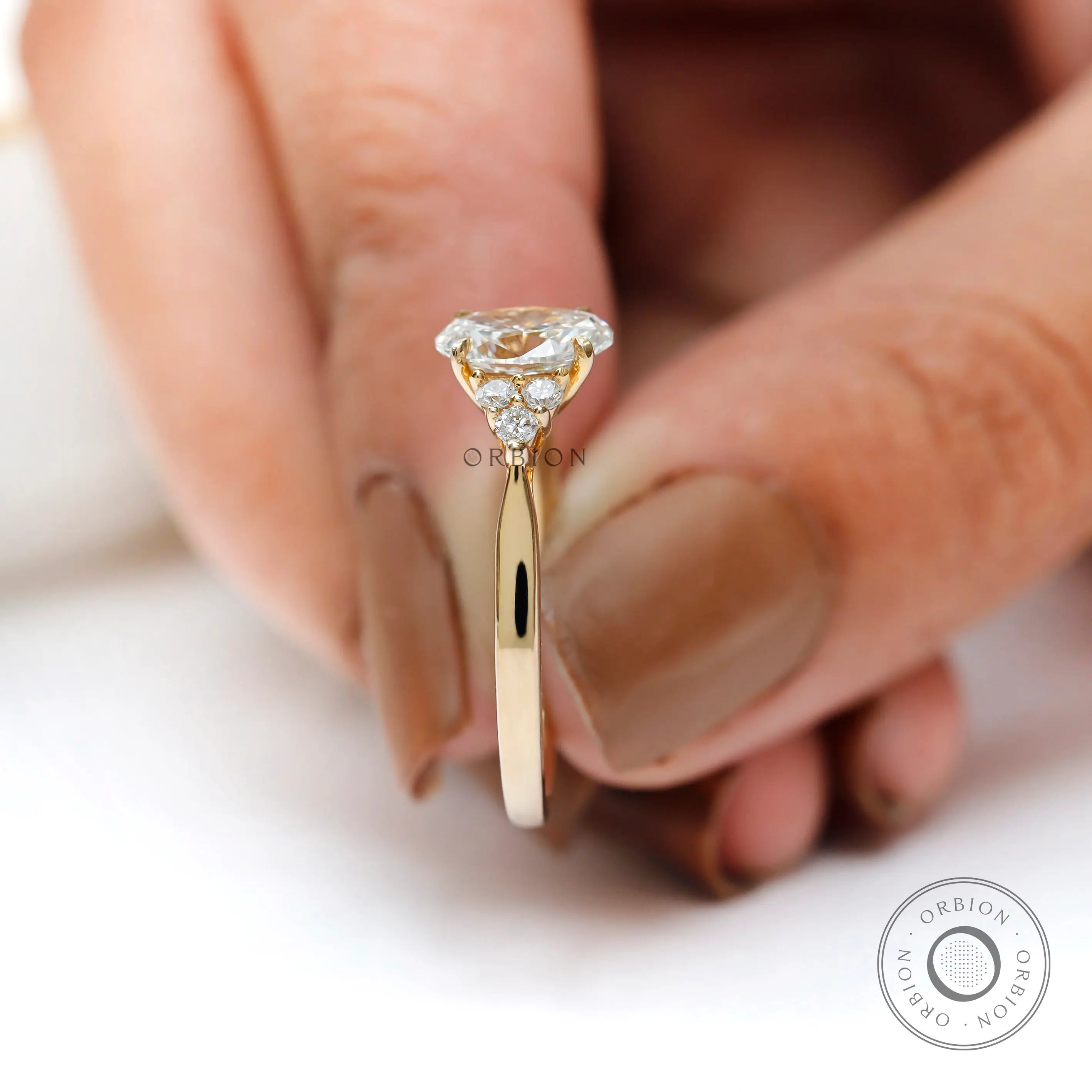 Oval diamond cluster engagement ring lifestyle image