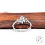 Close-up of marquise diamond cluster setting in white gold