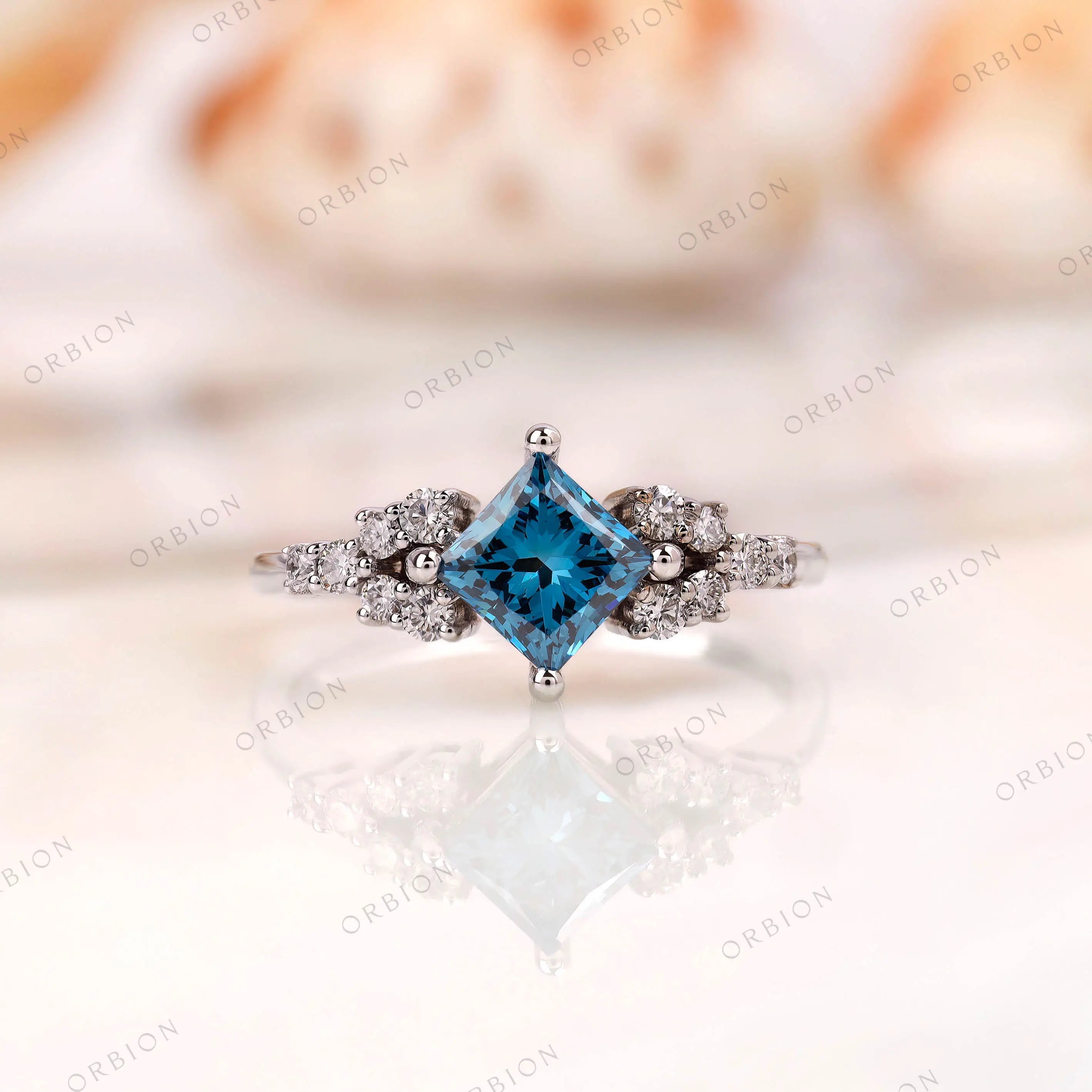 Princess cut fancy vivid blue lab grown diamond cluster engagement ring in 14K white gold