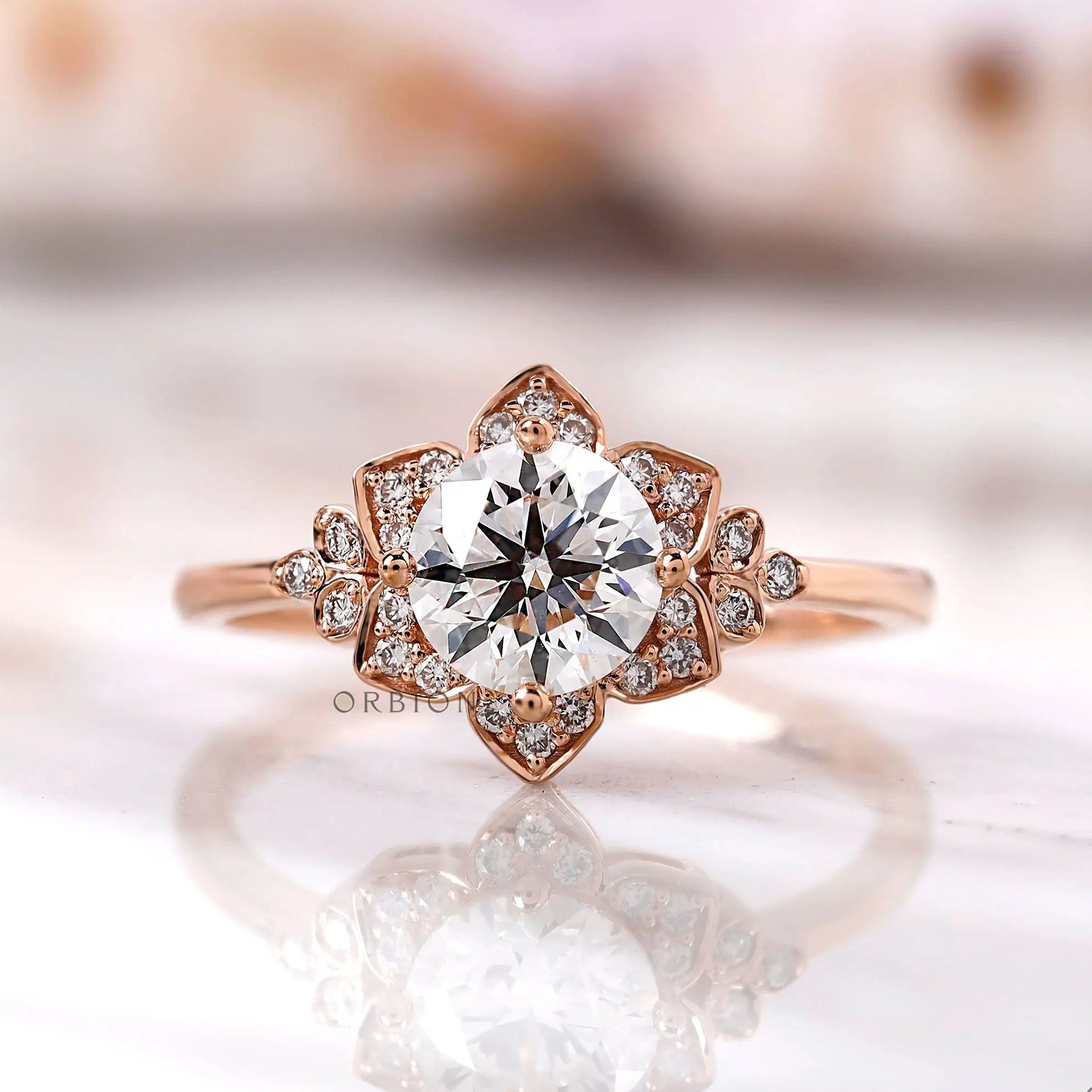 Floral halo lab grown diamond ring top view with rose gold petals