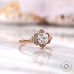 Round heart and arrow cut diamond halo ring close-up detailing