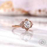Round heart and arrow cut diamond halo ring close-up detailing