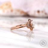 Rose gold floral halo engagement ring angled view