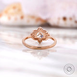 Lab grown diamond halo ring showing petal-inspired setting