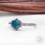 Blue lab grown diamond engagement ring with pavé band