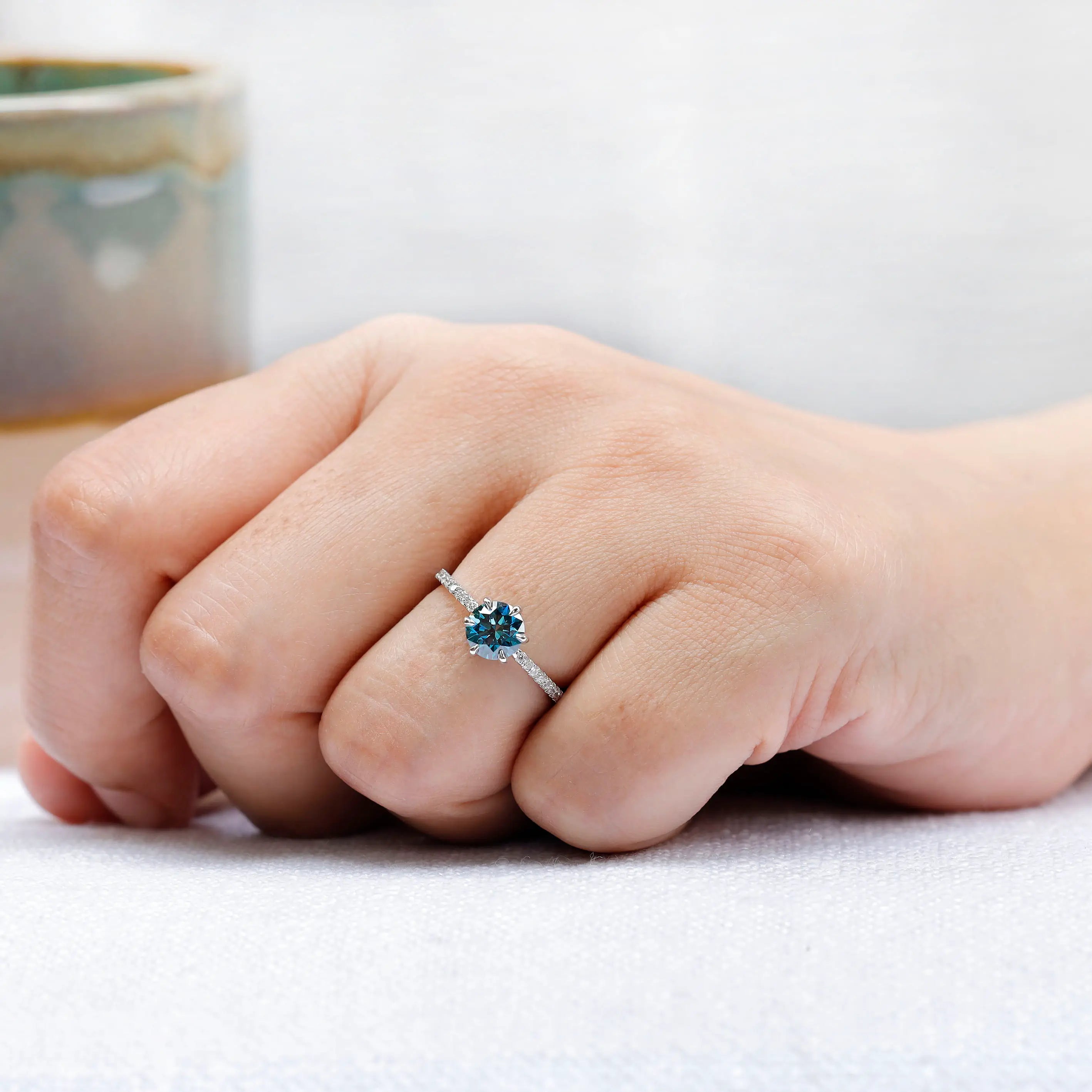 Fine white gold engagement ring with blue center stone