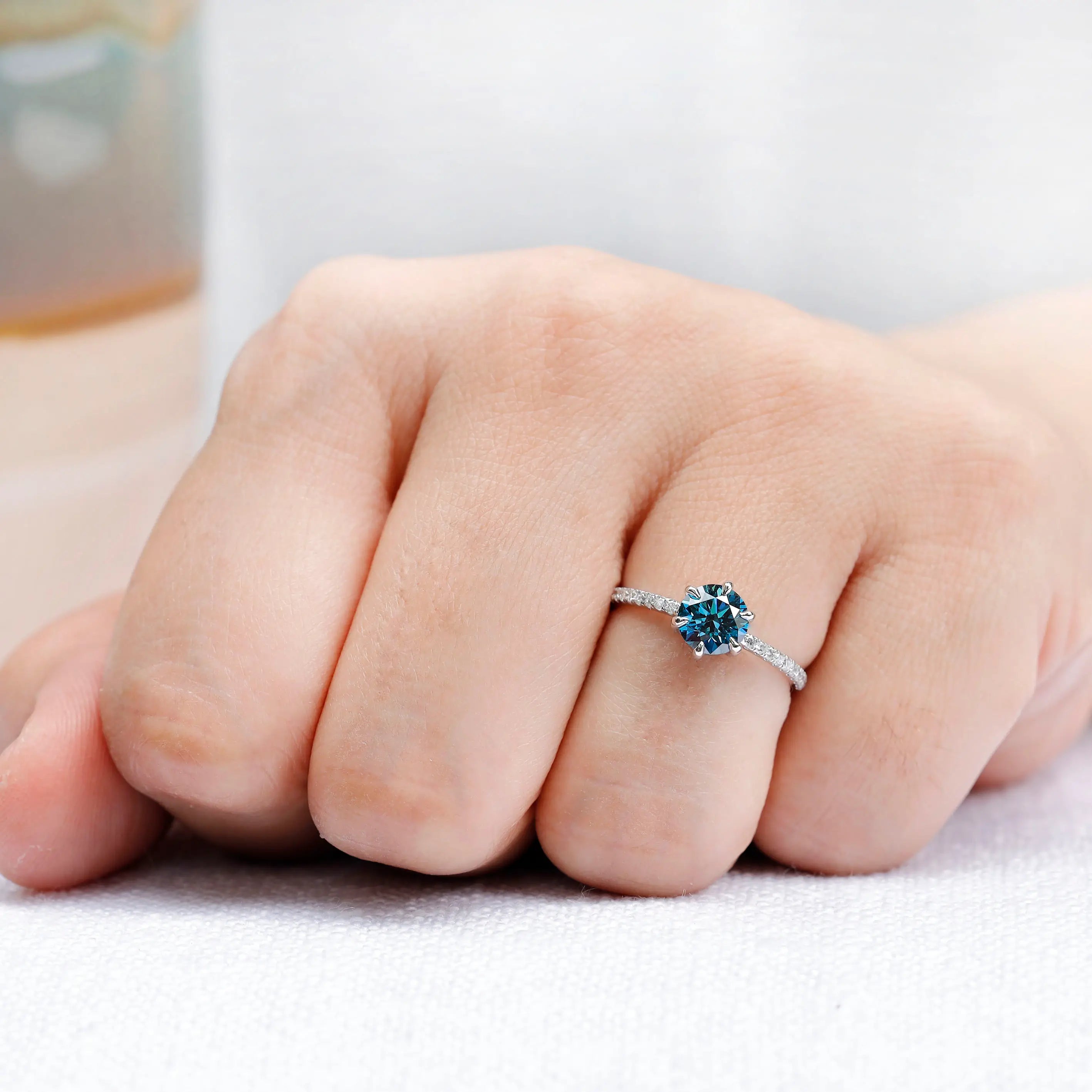 Minimal solitaire ring with vivid blue lab grown diamond