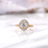 Round lab grown diamond halo engagement ring in 14K yellow gold front view
