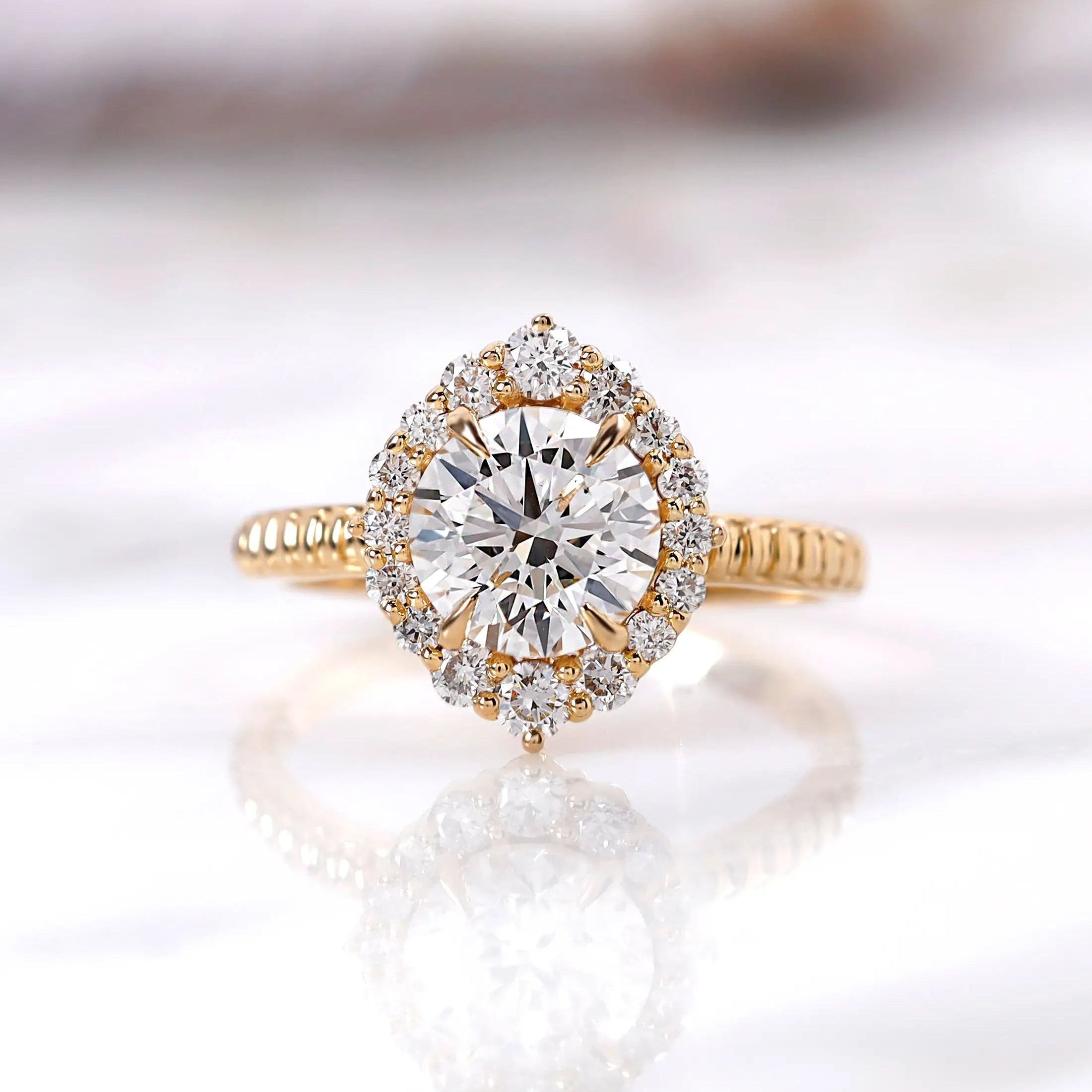 Round lab grown diamond halo engagement ring in 14K yellow gold front view