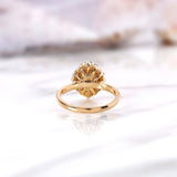Back view of yellow gold halo engagement ring showing open gallery