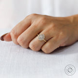 On-hand view of round lab grown diamond halo engagement ring