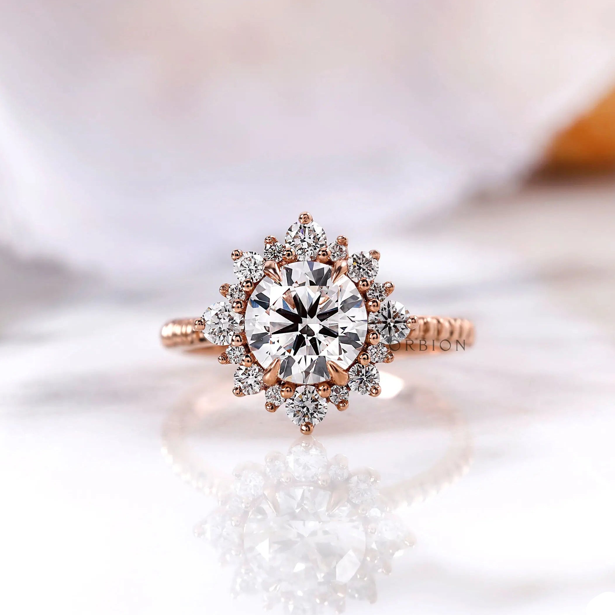 Round lab grown diamond halo engagement ring in 14K rose gold front view