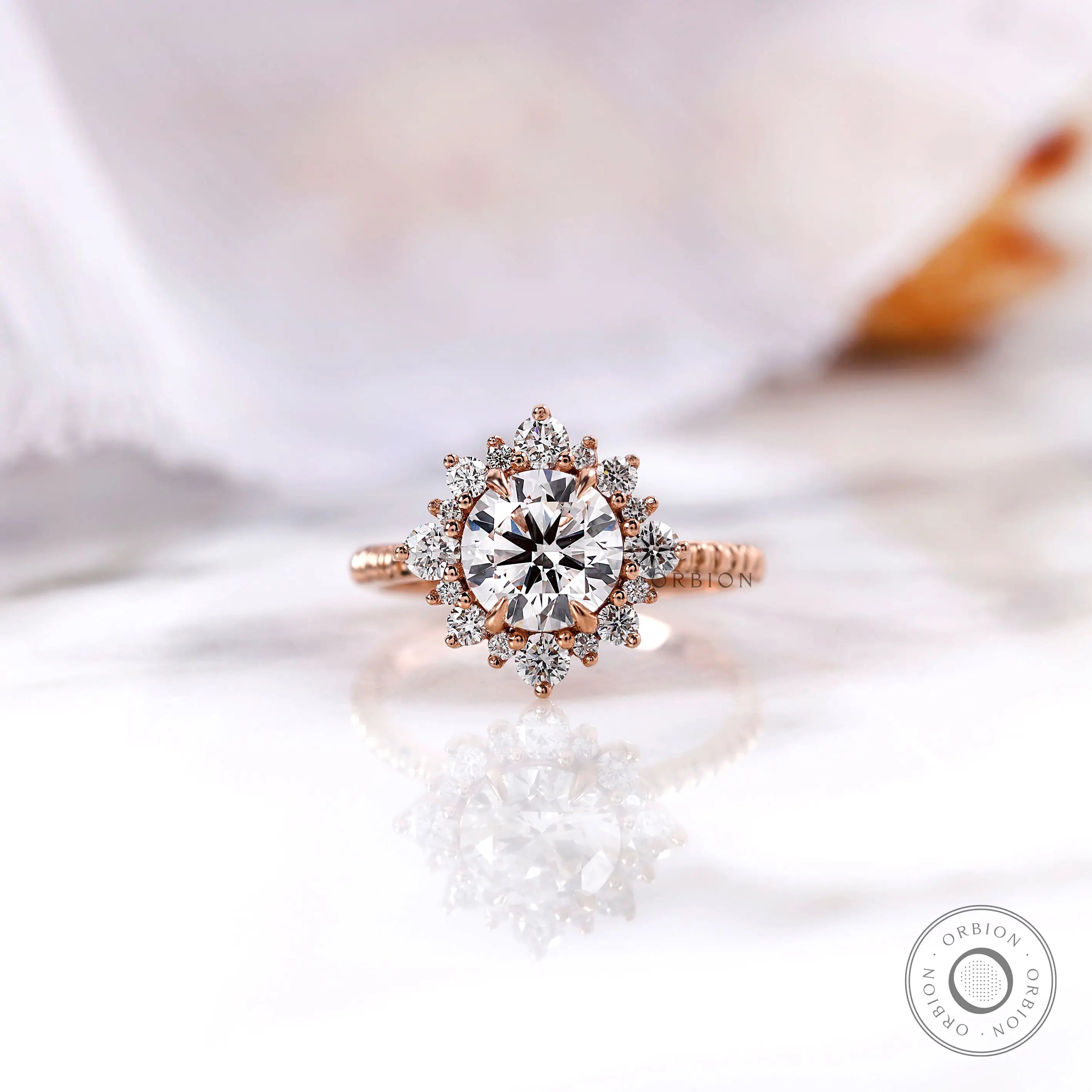 Round lab grown diamond halo engagement ring in 14K rose gold front view