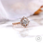 Rose gold halo diamond ring angled side view