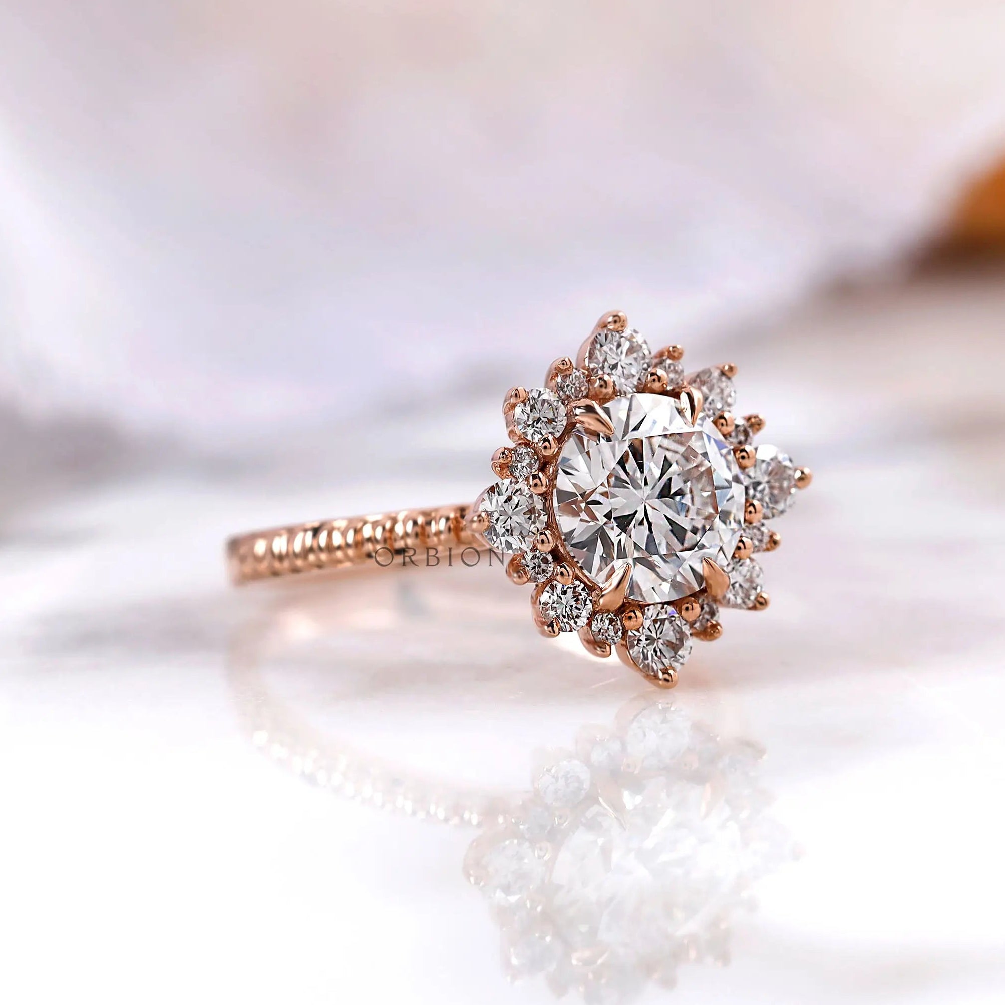Rose gold halo diamond ring angled side view