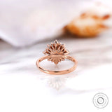 Round diamond engagement ring profile showing halo setting