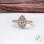 Pear cut lab grown diamond halo engagement ring in 14k yellow gold