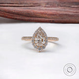 Pear cut lab grown diamond halo engagement ring in 14k yellow gold
