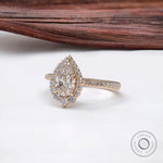 Front view of pear diamond halo ring with pavé band