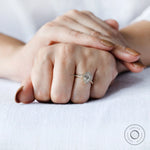 Yellow gold pear diamond ring with pavé accents