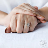 Yellow gold pear diamond ring with pavé accents