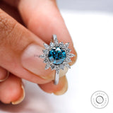 Round blue diamond halo ring top view