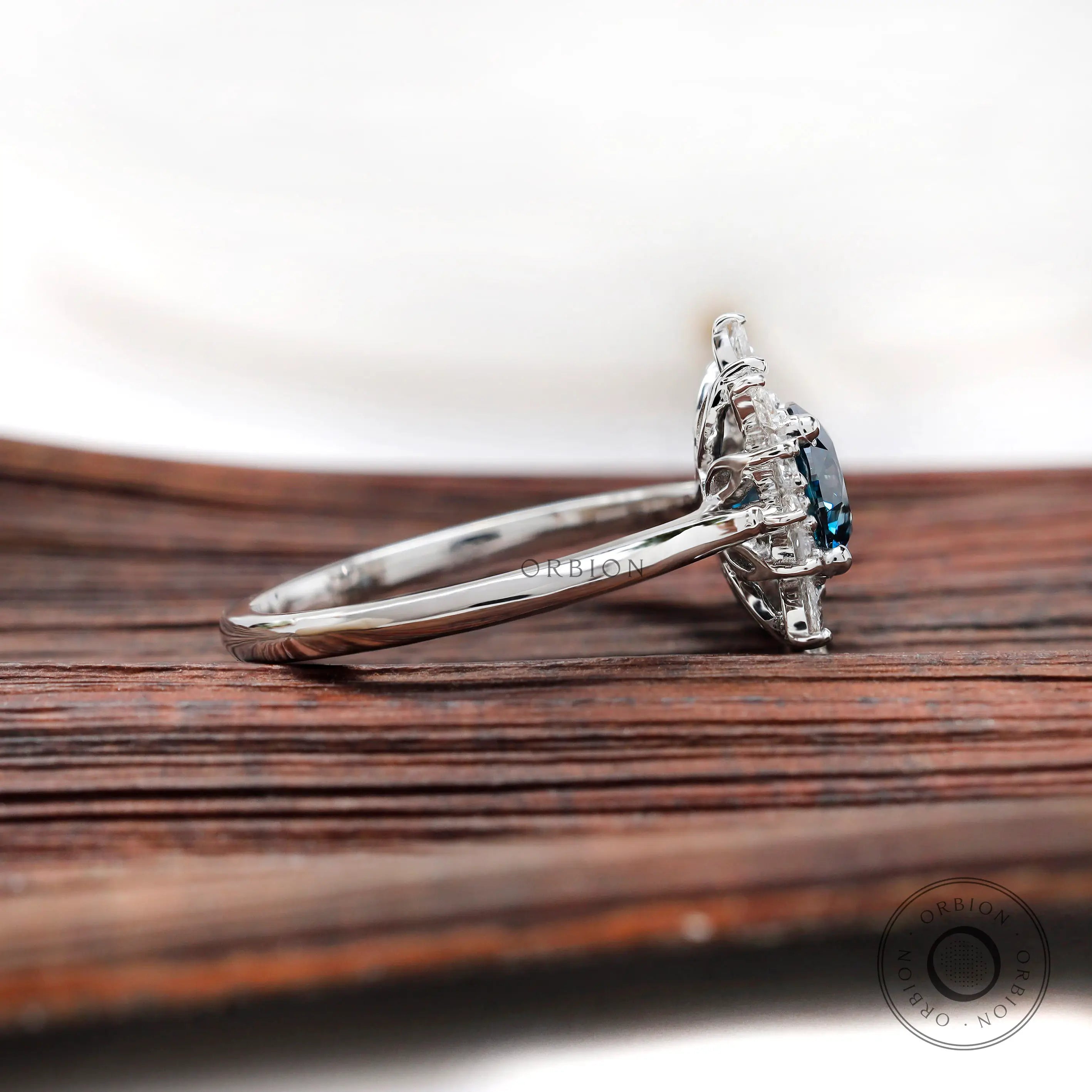 Blue diamond halo ring side profile