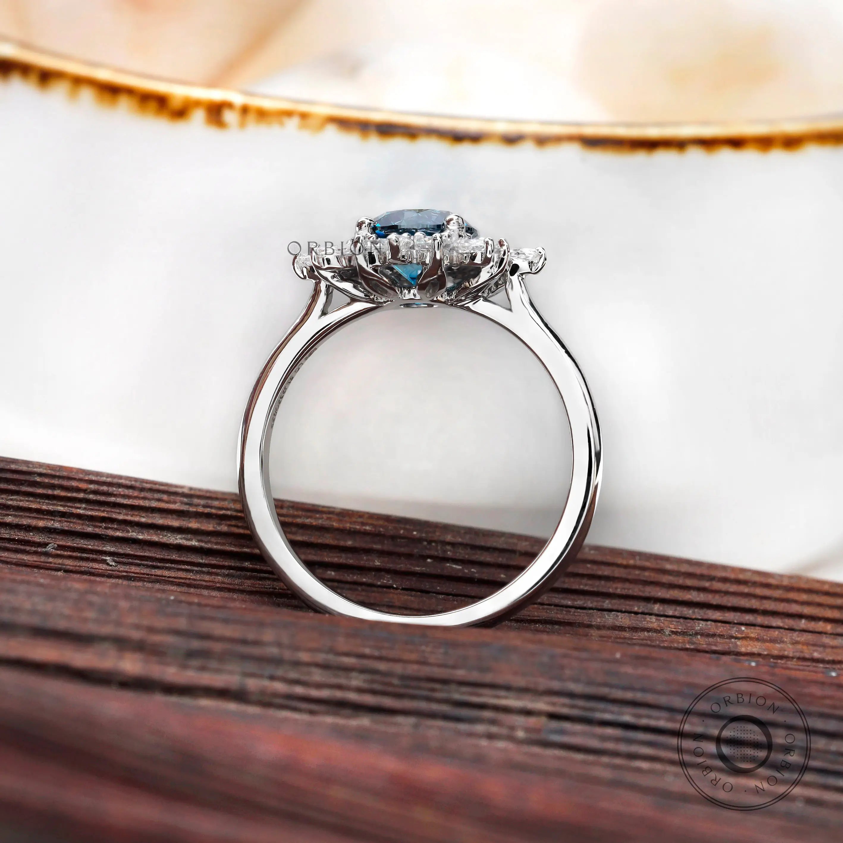 Marquise and round diamond halo detailing