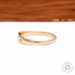 Side profile of yellow gold starburst diamond band with smooth taper.