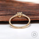 Rear view of prong set round and pear diamond ring