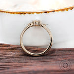 Angled view highlighting pear side stone accents