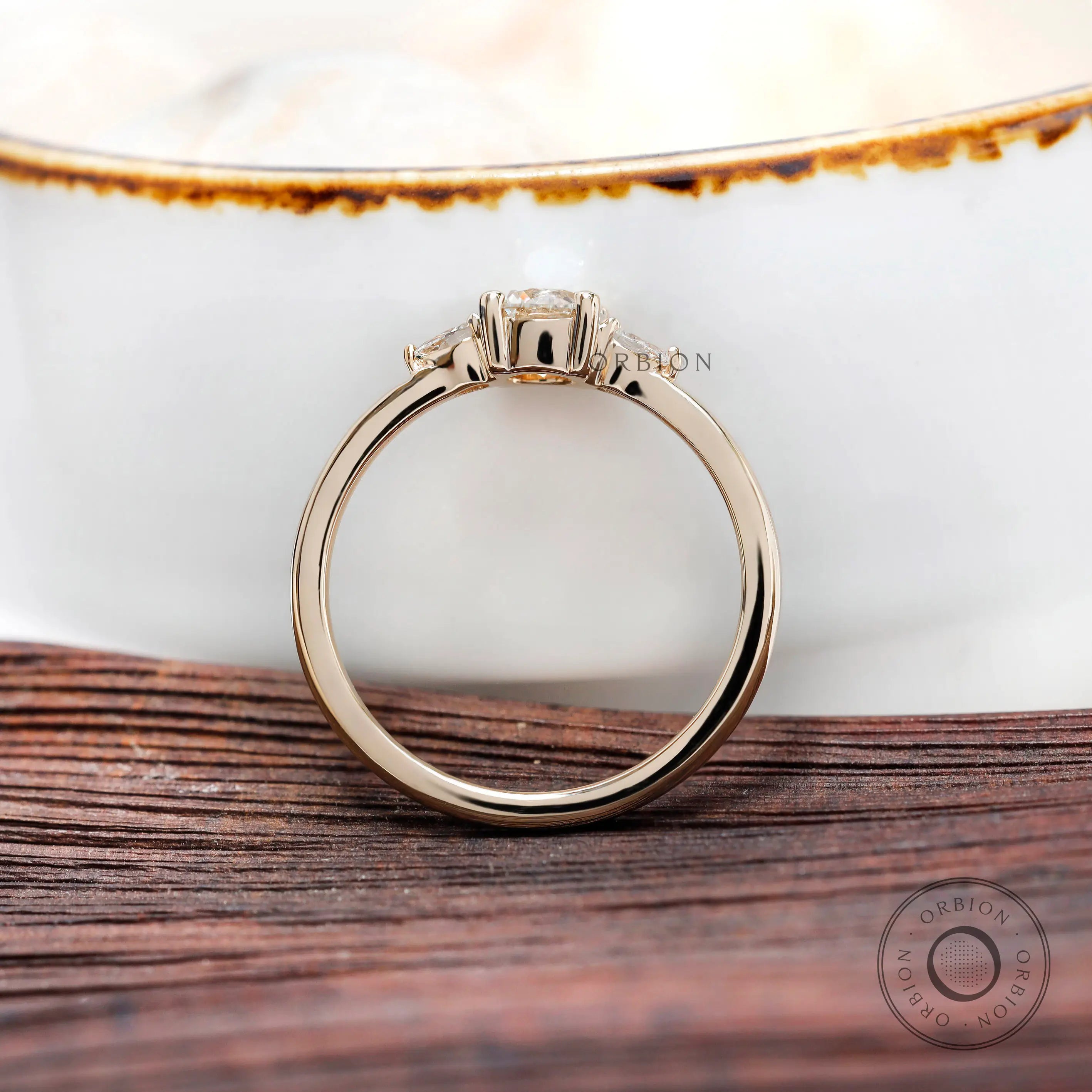 Angled view highlighting pear side stone accents