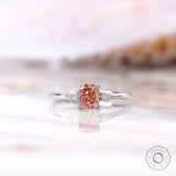 Cushion cut pink diamond ring with pear side stones