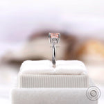 Elegant pink diamond ring with pear accents