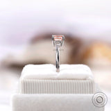 Elegant pink diamond ring with pear accents