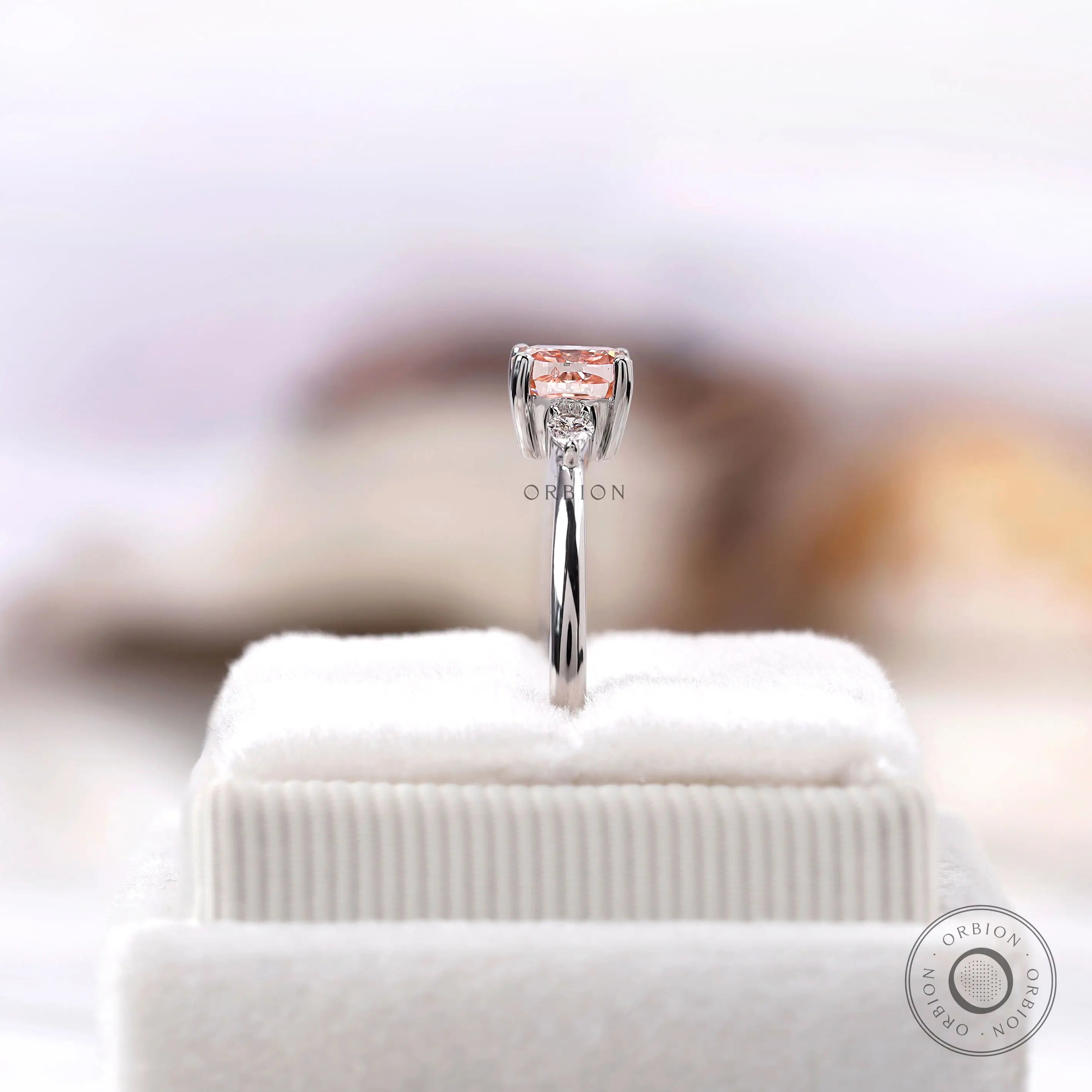 Elegant pink diamond ring with pear accents