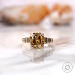 Elongated cushion dark champagne moissanite ring with baguette accents