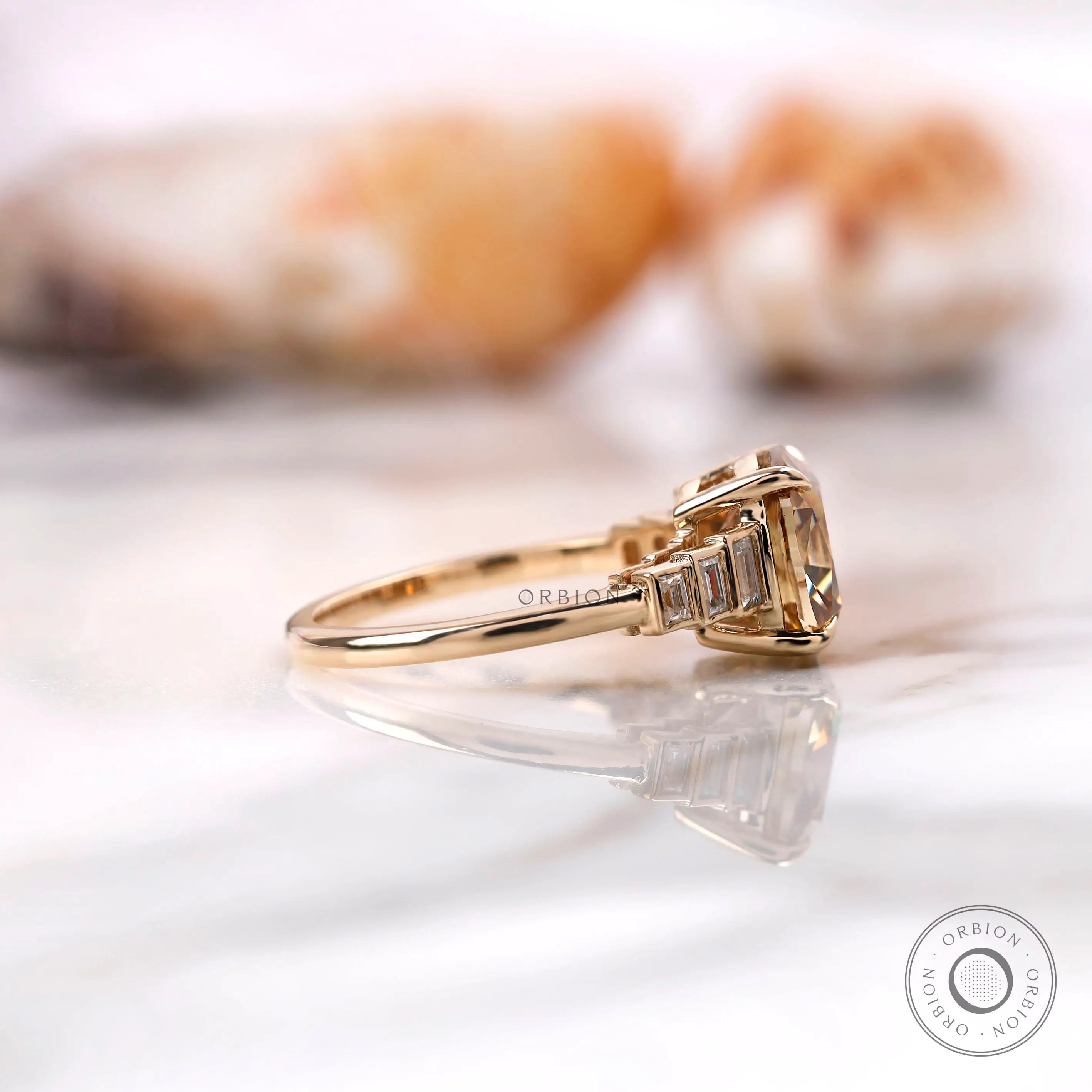 Side profile of baguette accented moissanite ring in yellow gold