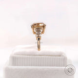 Step cut baguette side stone detail on champagne moissanite ring