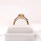 Three stone style moissanite ring with elongated cushion center