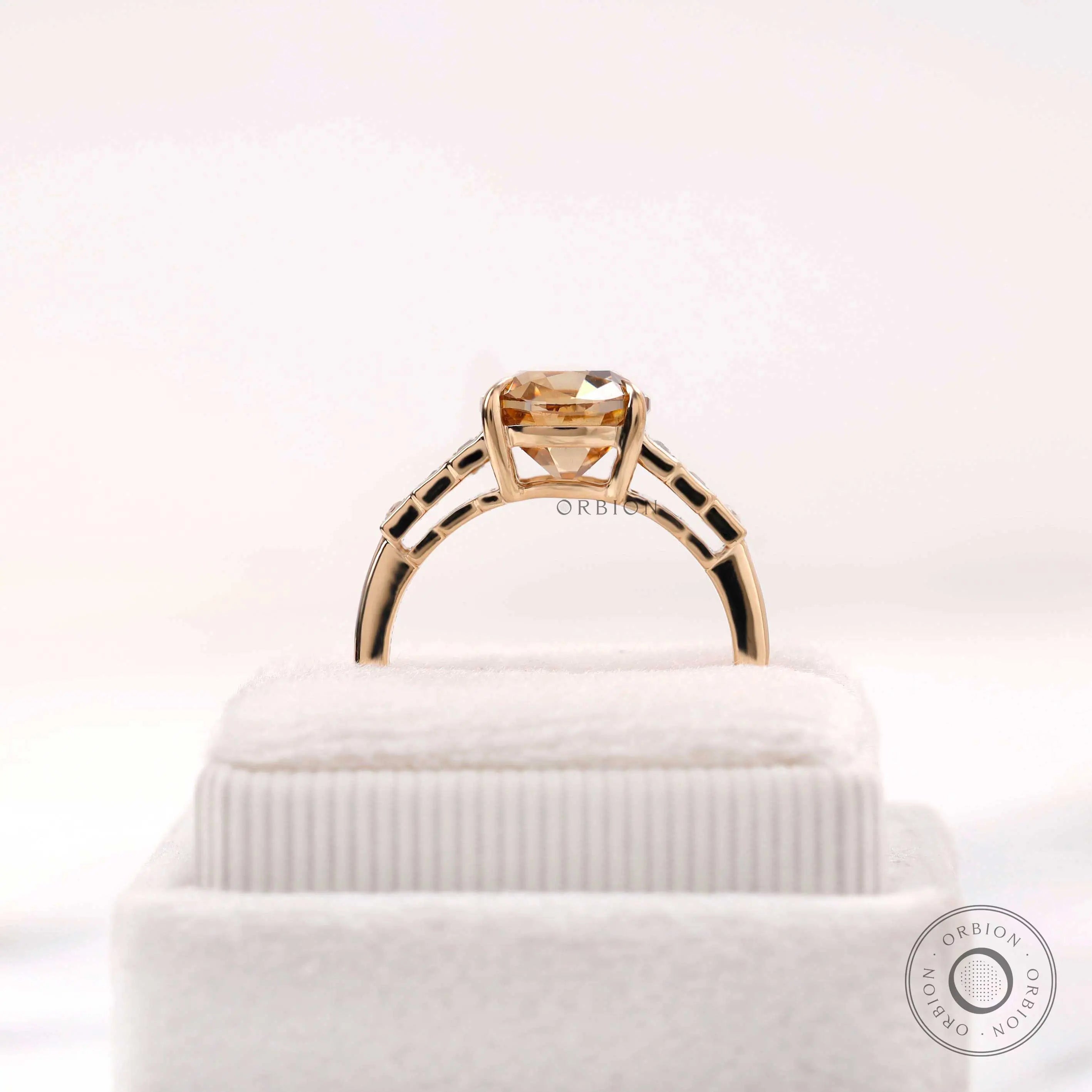 Three stone style moissanite ring with elongated cushion center